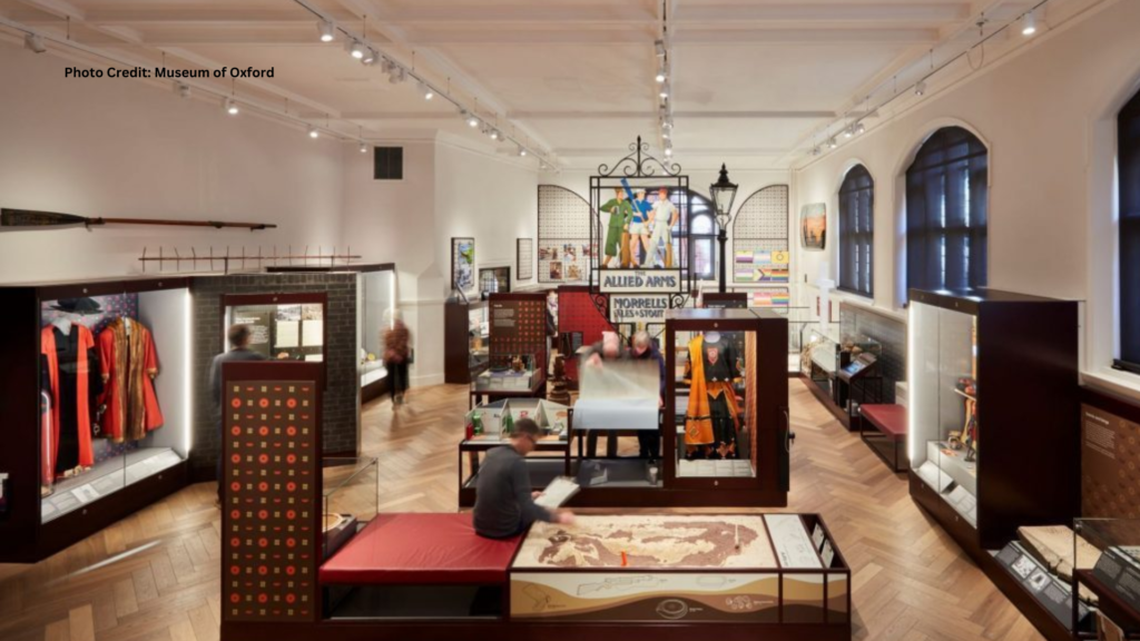 Interior of the Museum of Oxford, showcasing various artifacts from Oxford residents hundreds of years ago, including clothing pieces.